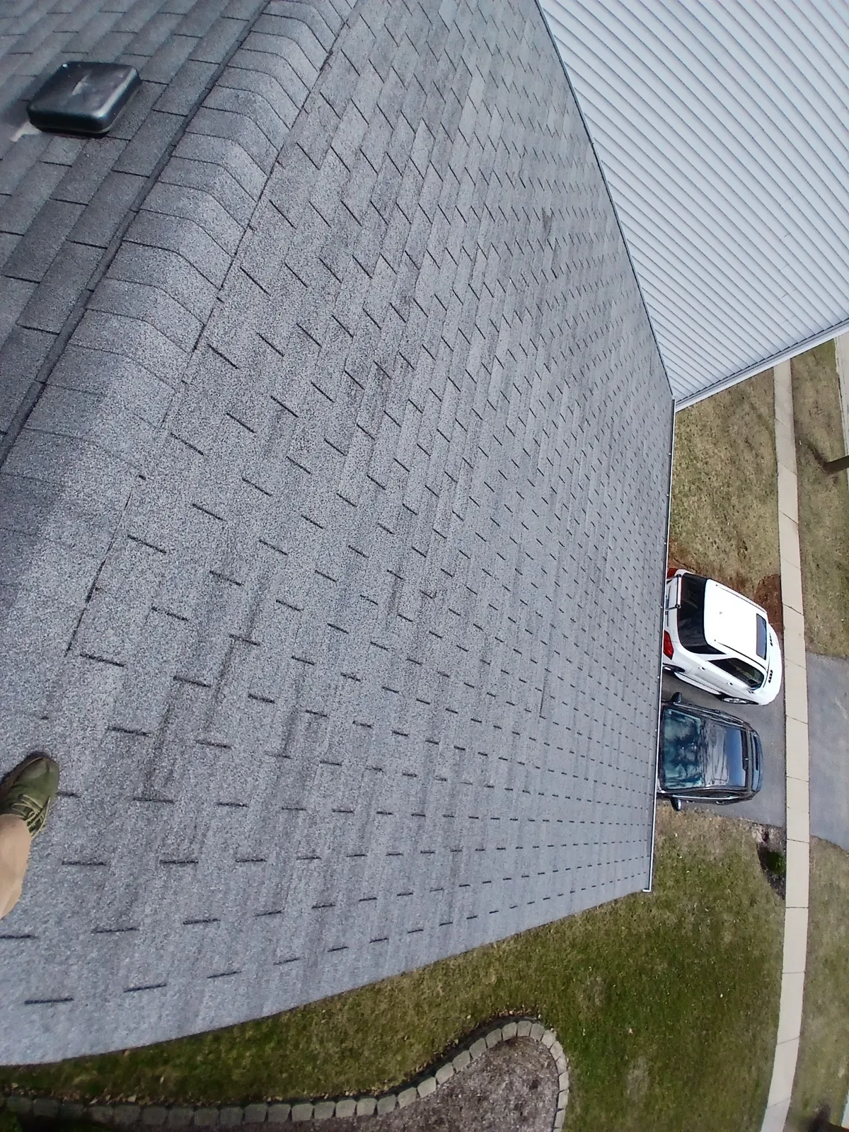 New charcoal gray architectural shingle roof on a residential home in West Chicago, IL