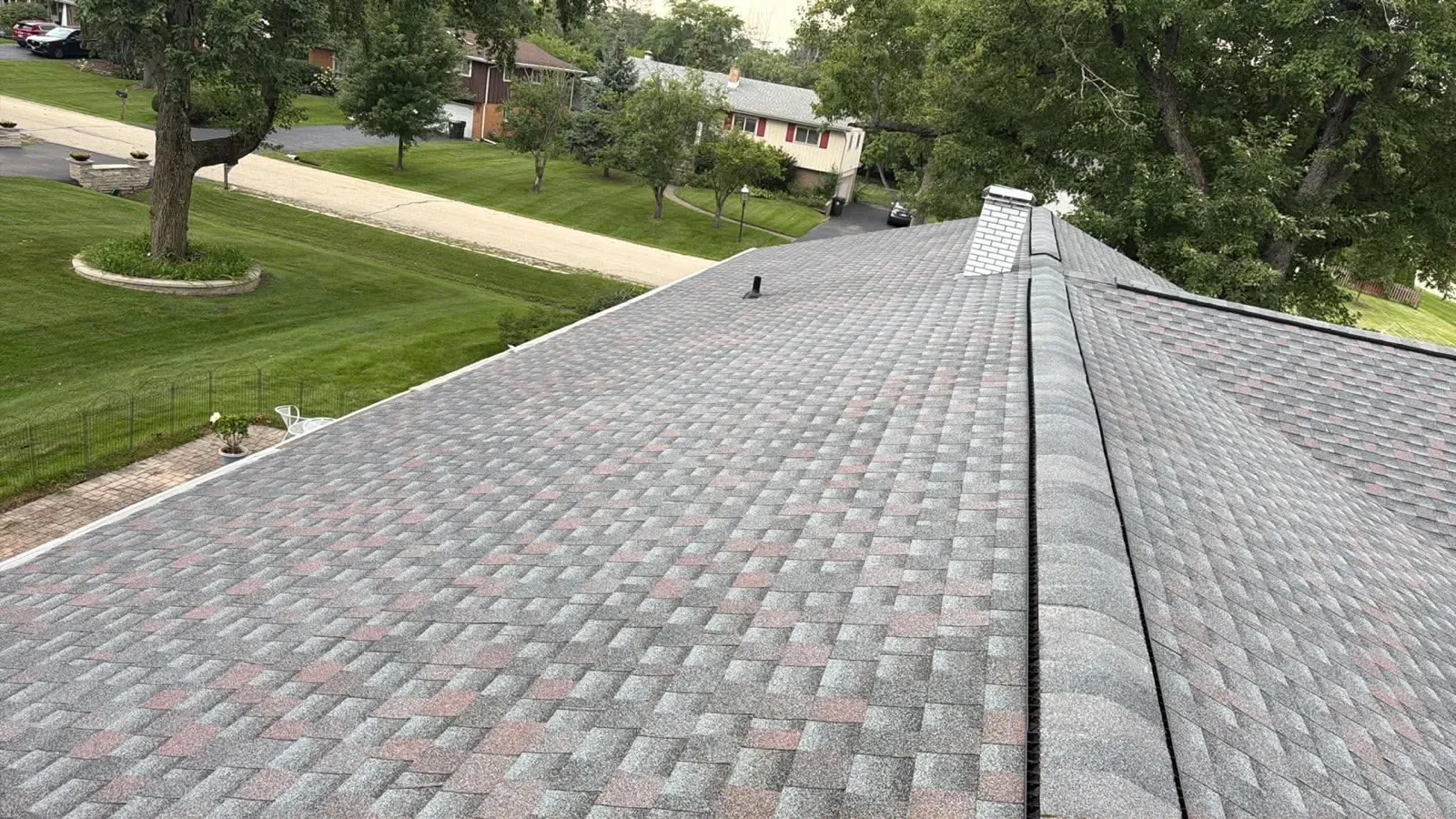 New multi-toned gray architectural shingle roof on a residential home in Willowbrook, IL