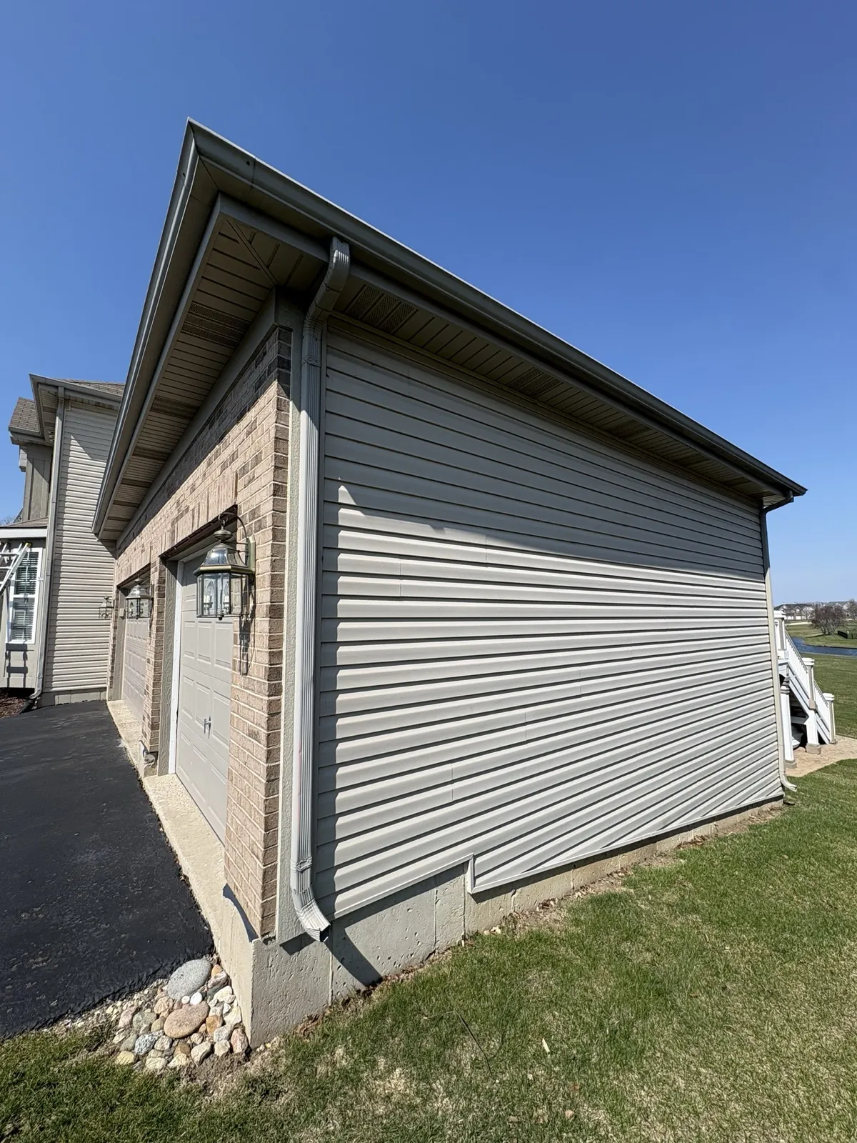New gray vinyl siding installed on a residential building in Yorkville, IL